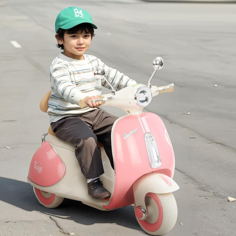 Child riding kids electric scooter outdoor